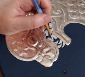 Painting the Teeth of the Heraldic Lion Rampant